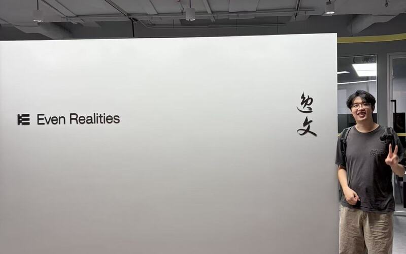 Standing beside the Even Realities office sign